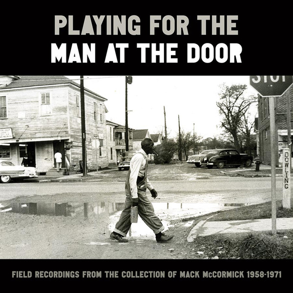 Playing For The Man At The Door
