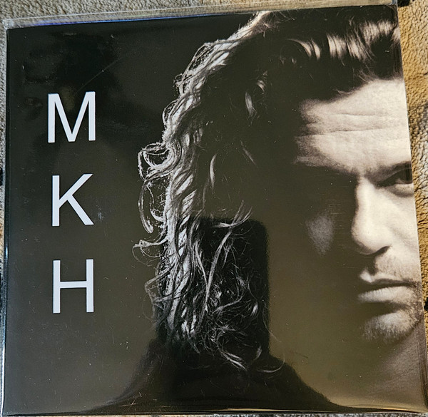M K H